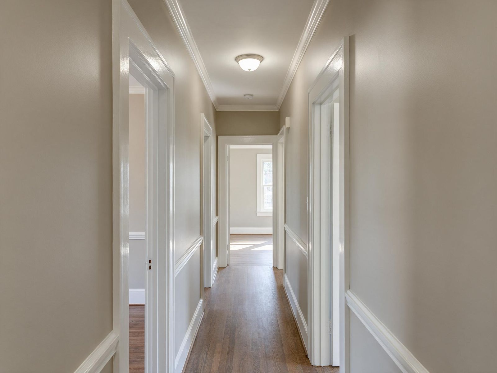 A finished hallway in a warm greige eggshell